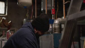 technician monitoring a heater